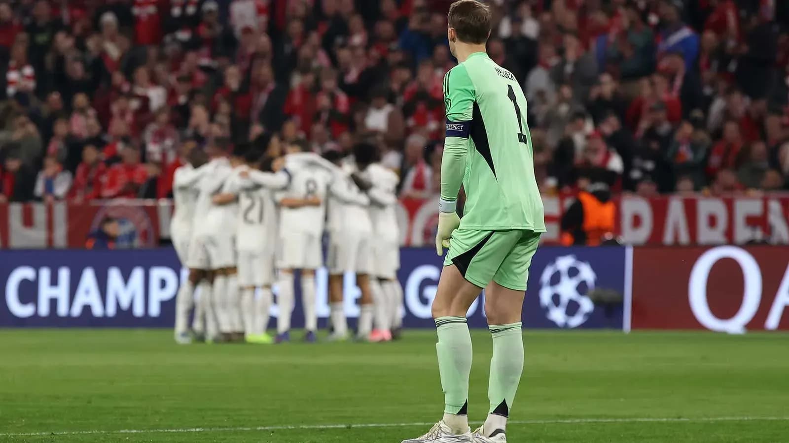 Goalkeeper watching teammates celebrate a goal