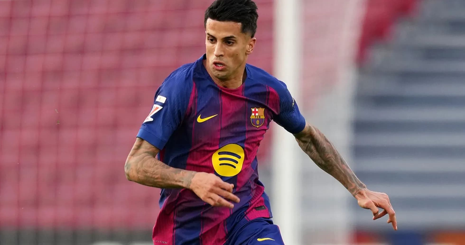 Player in Barcelona kit running during a match