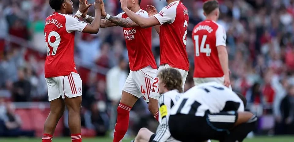 Arsenal players celebrating during match against Newcastle