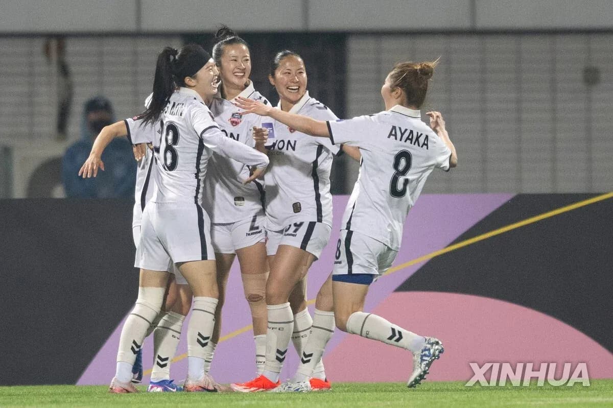 Players celebrating a goal in WK-League match