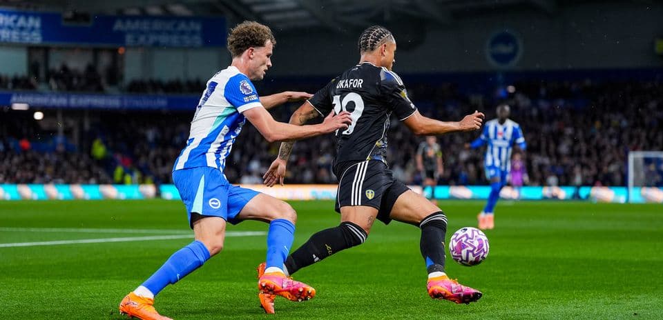 Leeds player being challenged by Brighton player