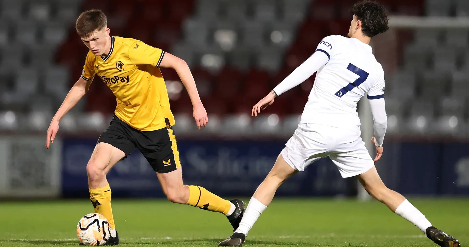 Wolves U21 player dribbling past Tottenham U21 defender