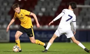 Wolves U21 player dribbling past Tottenham U21 defender