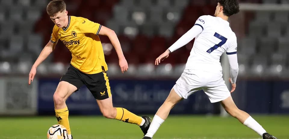 Wolves U21 player dribbling past Tottenham U21 defender
