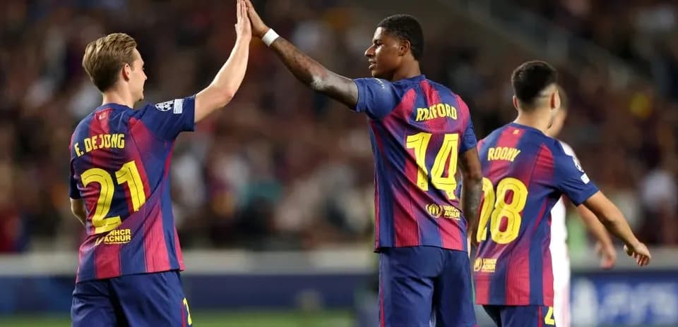 Players celebrating with a high-five on the pitch