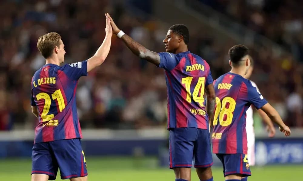 Players celebrating with a high-five on the pitch