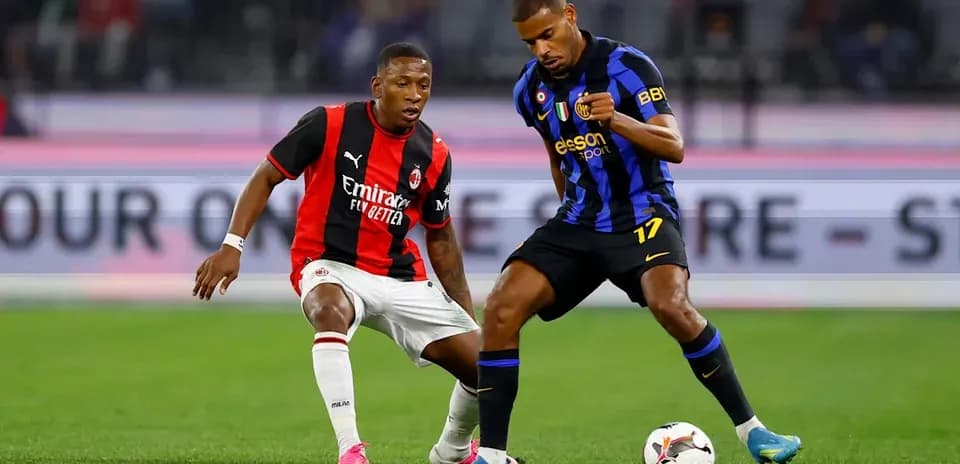 Two players contesting for the ball during match