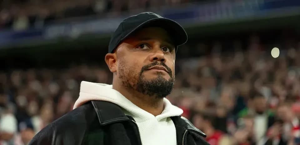 Man in black cap and coat at stadium