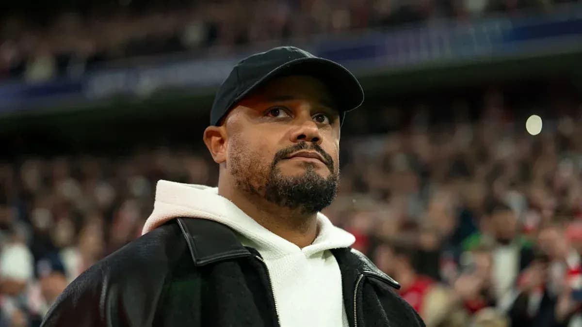Man in black cap and coat at stadium