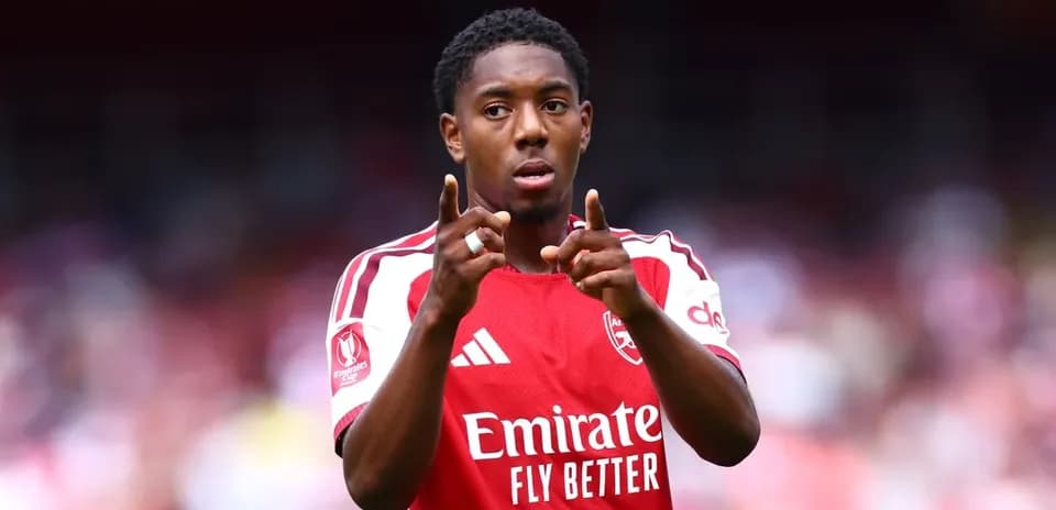 Player gesturing during a match for Arsenal