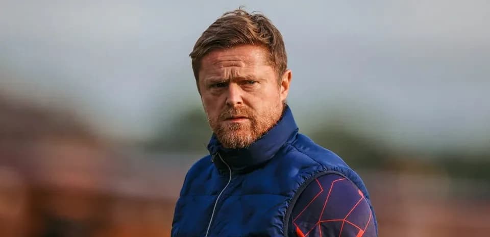 Coach observing training session at the pitch