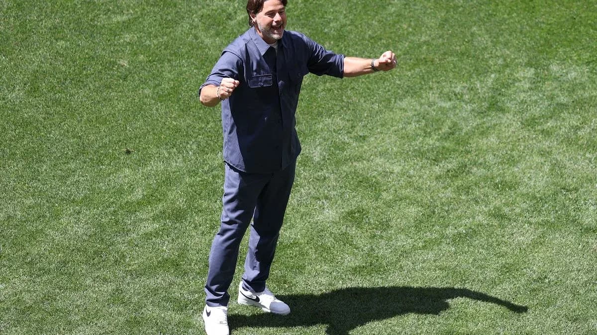Coach celebrating on the field during practice