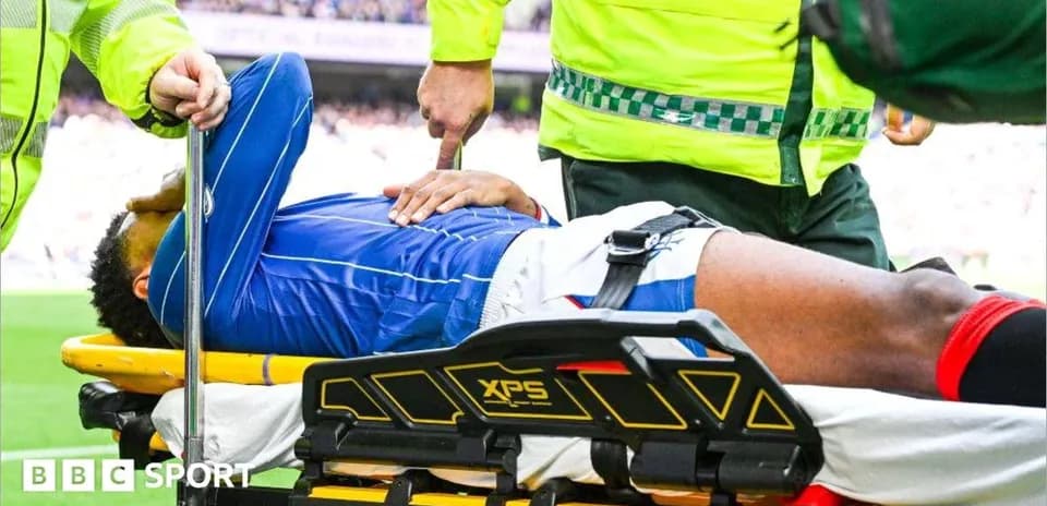 Player being stretchered off the field by medics