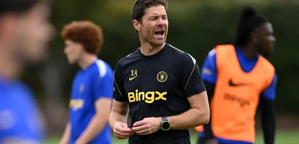 Coach instructing players during training session