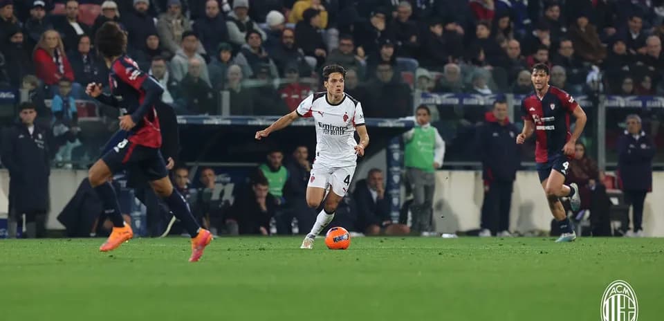 AC Milan player dribbling during match against Cagliari
