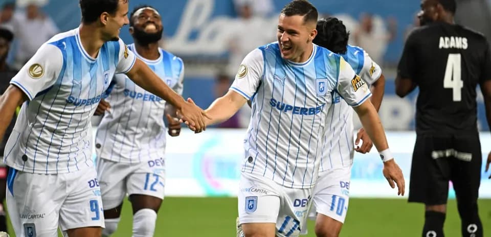Players celebrating a goal during match