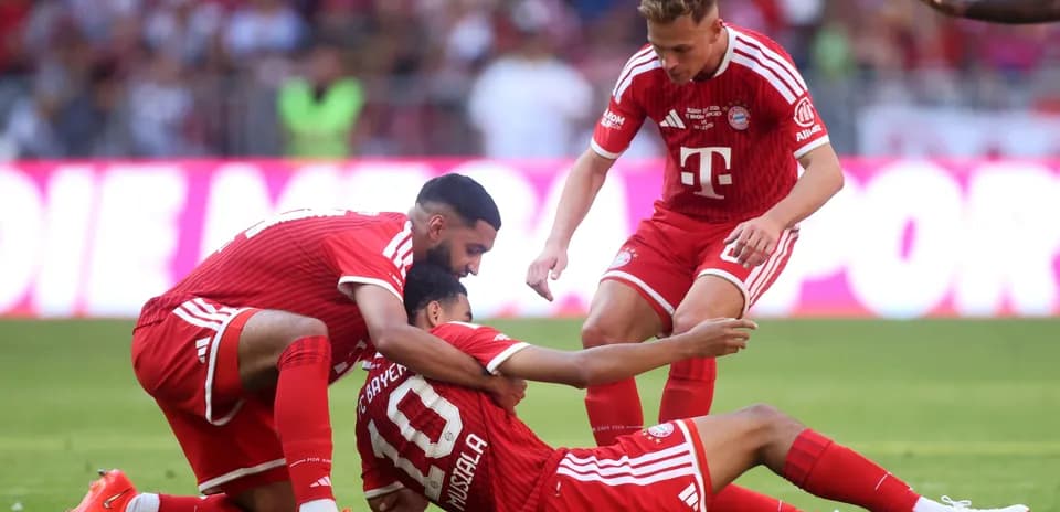 Bayern Munich players celebrating a goal on the field