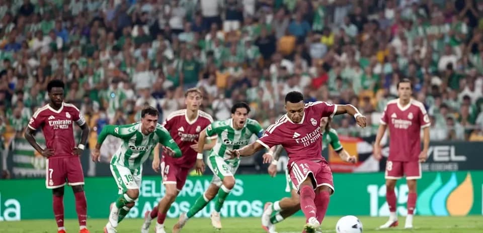 Player taking penalty kick during football match