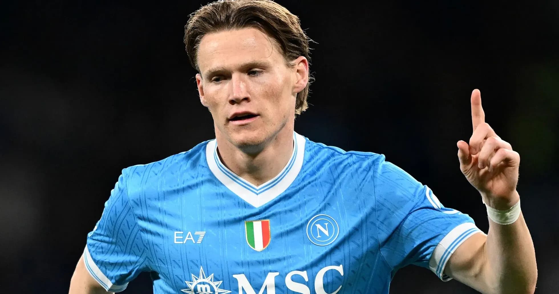 Player celebrating in Napoli's blue home jersey