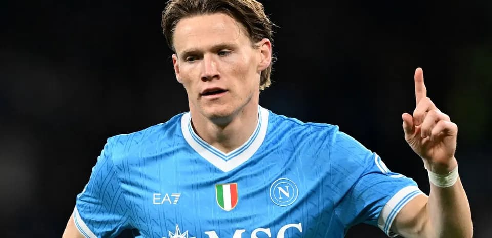 Player celebrating in Napoli's blue home jersey