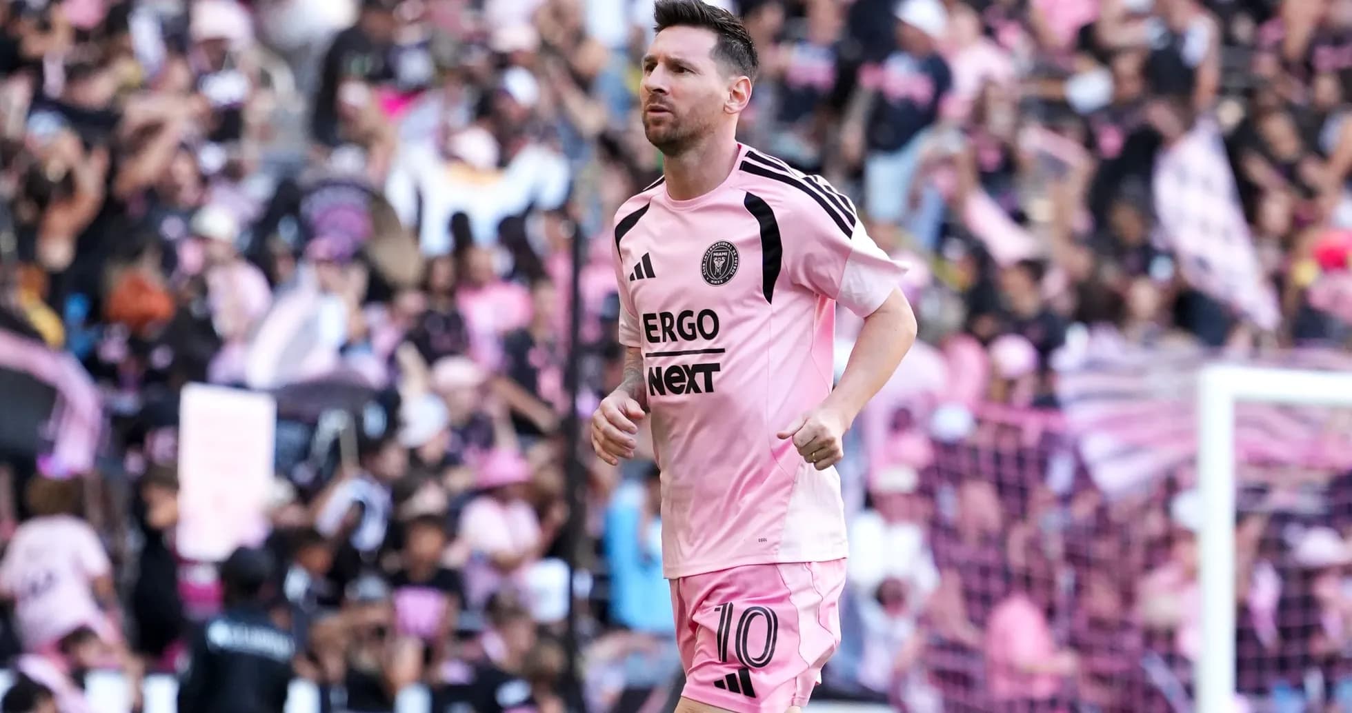 Lionel Messi running on field during match