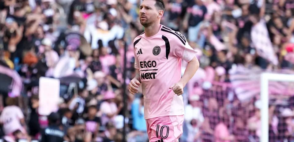 Lionel Messi running on field during match