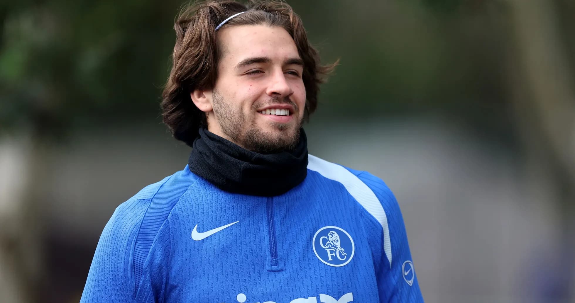 Player smiling during training session in blue kit