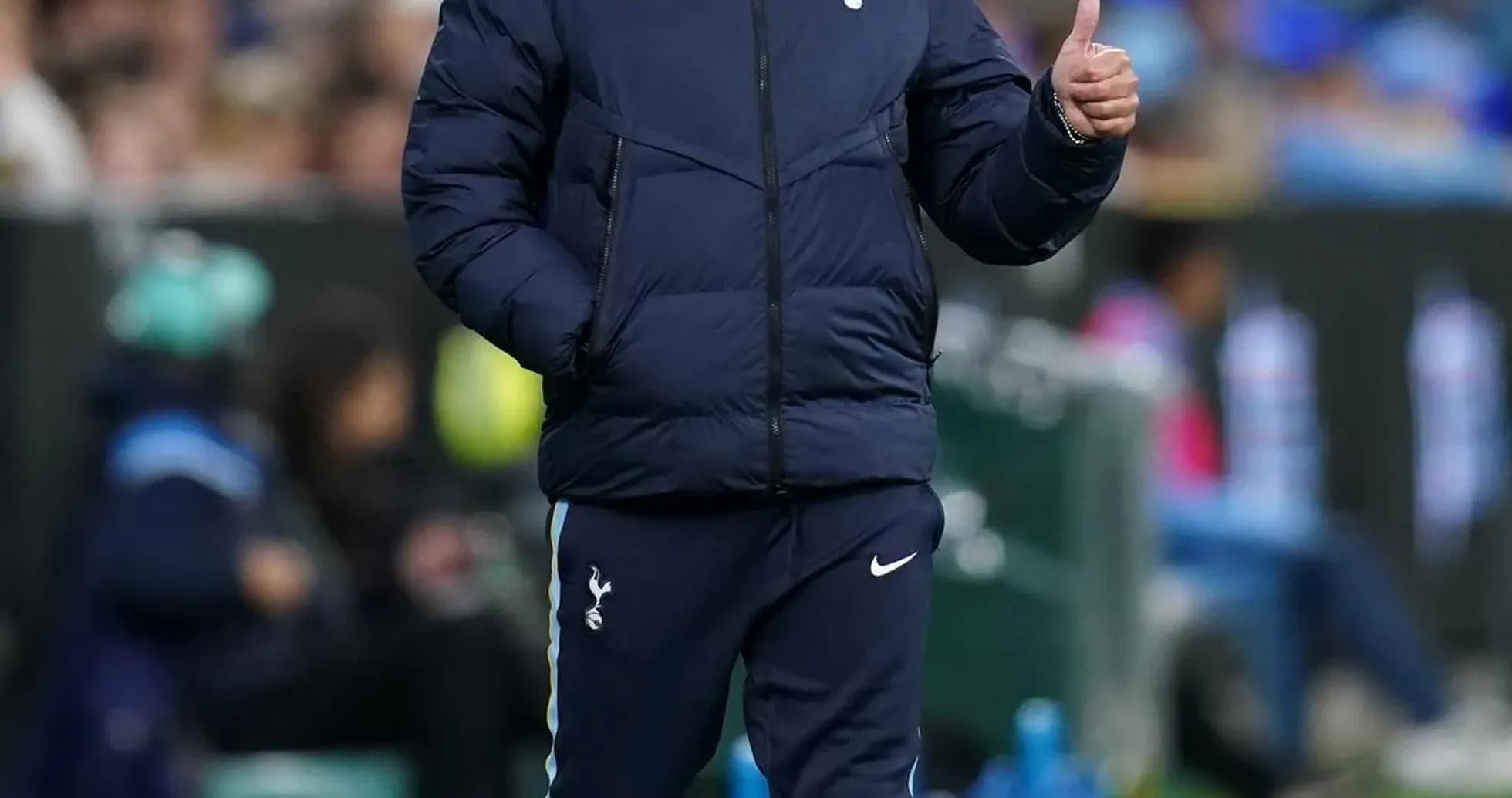 Manager walking on the sideline during match