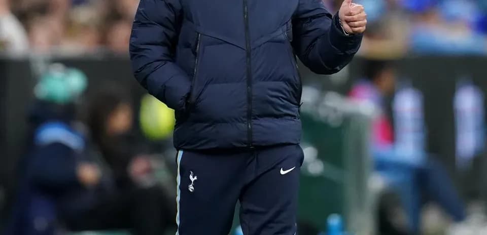 Manager walking on the sideline during match
