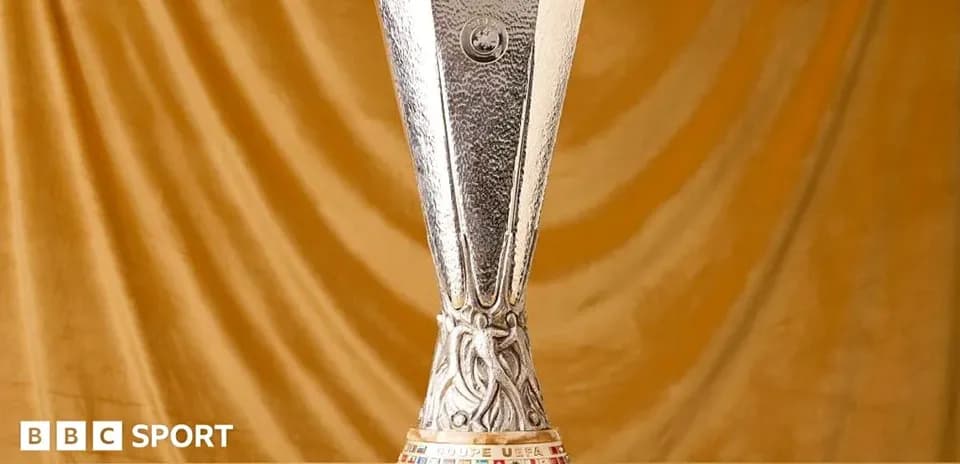 UEFA Europa League trophy on golden backdrop