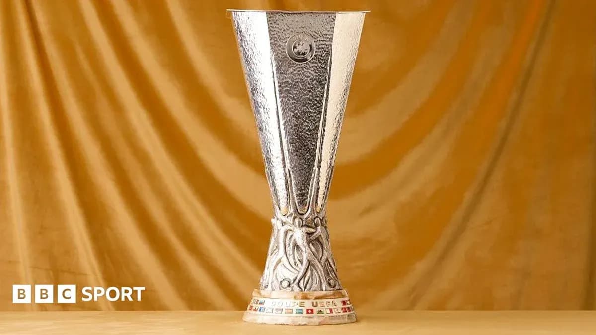 UEFA Europa League trophy on golden backdrop