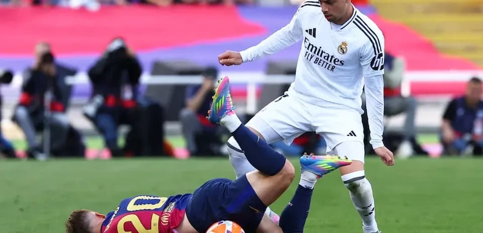 Player tackle during Barcelona vs Real Madrid match