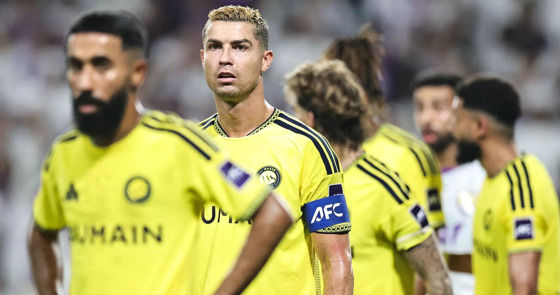Players in yellow jerseys during a football match