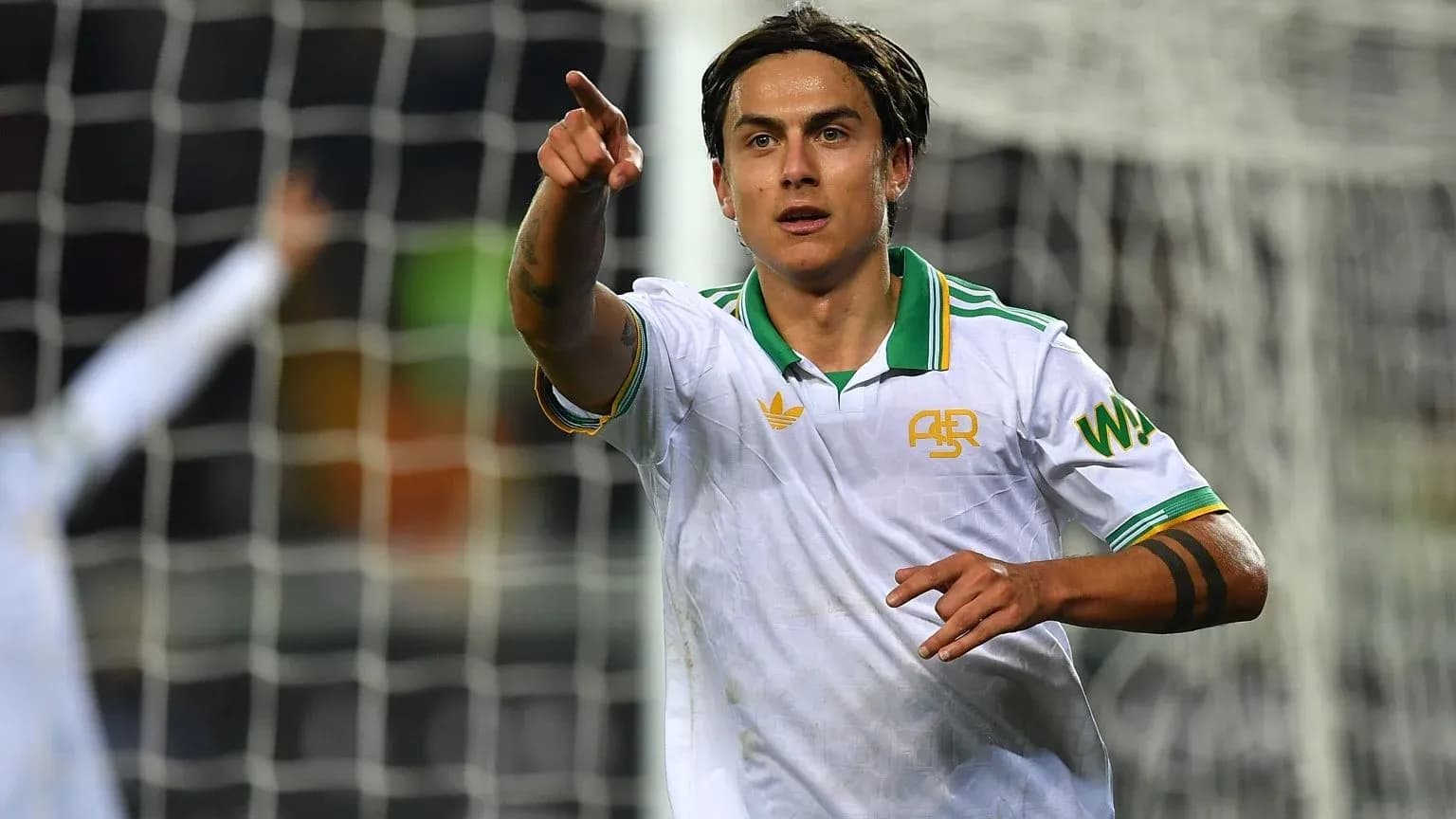 Player celebrating and pointing after scoring a goal