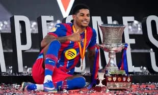 Player celebrating with trophy after winning match