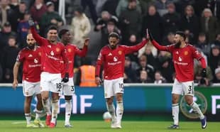 Manchester United players celebrating a goal together