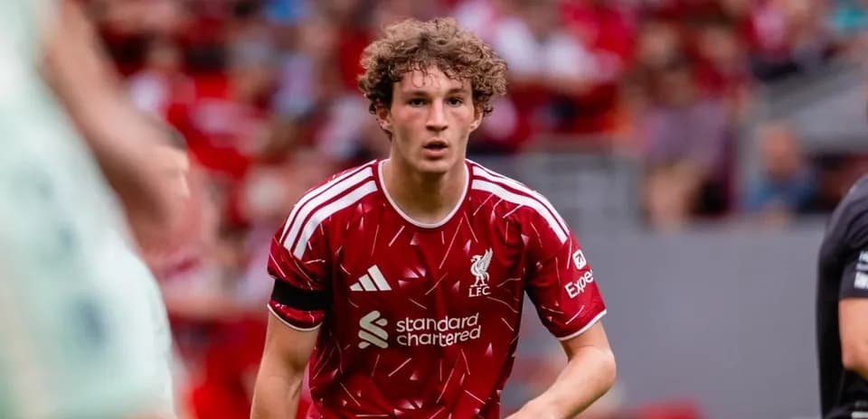 Liverpool player running during match at Anfield