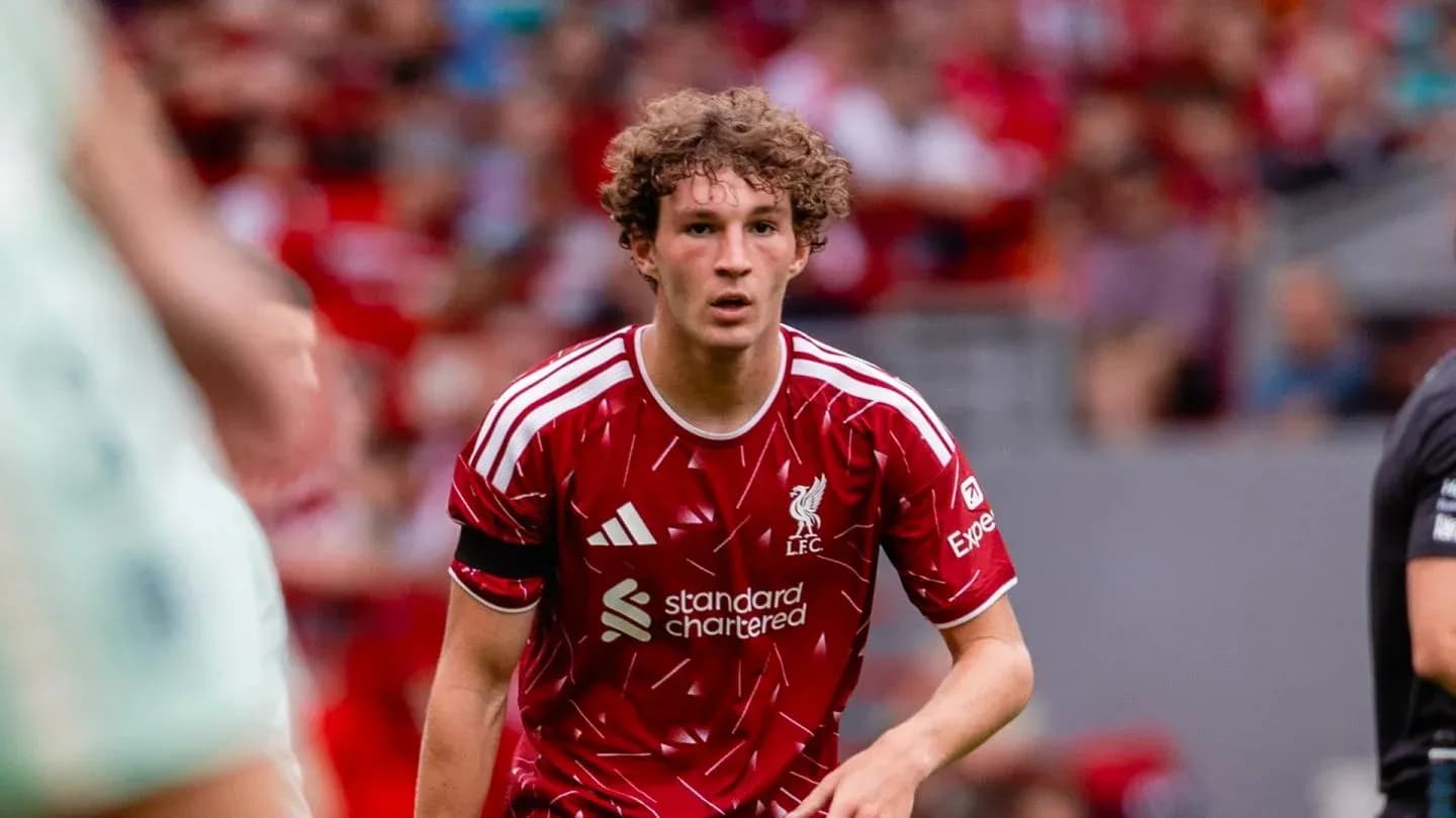 Liverpool player running during match at Anfield