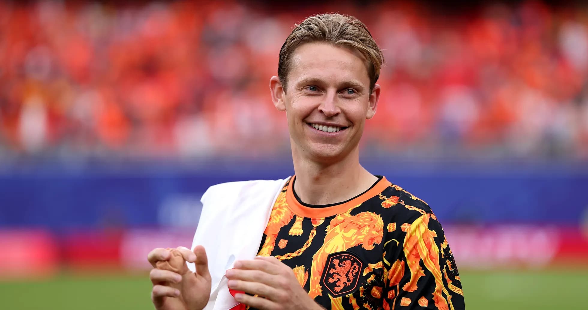 Player in colorful shirt smiling on the field