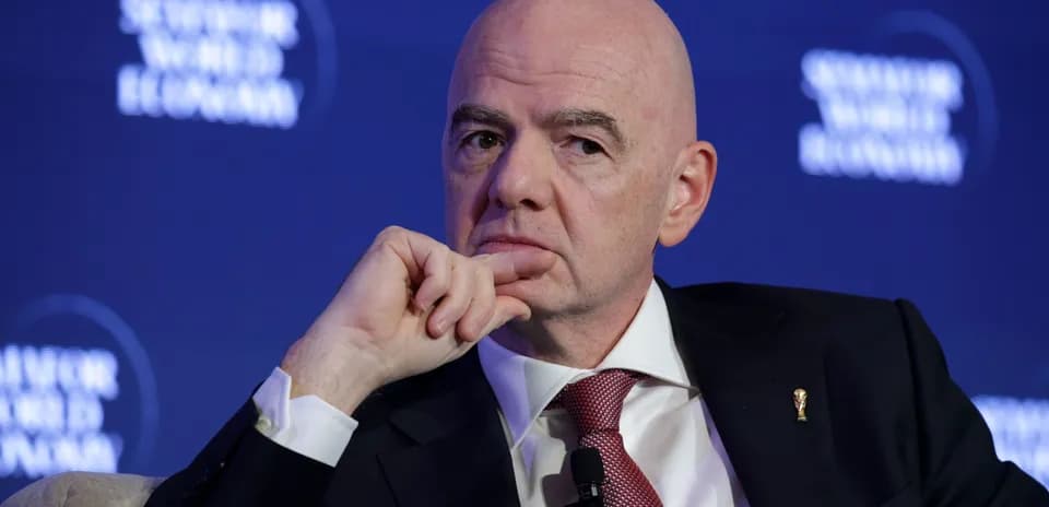 Man pondering during discussion at conference