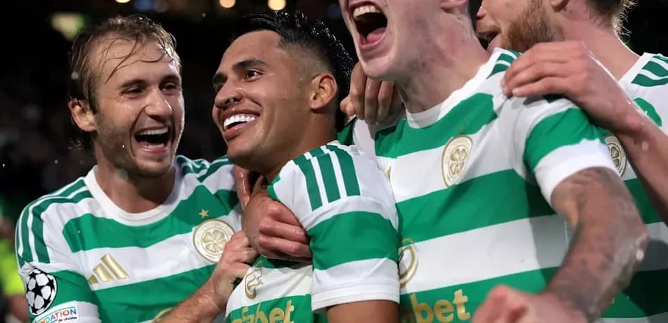 Celtic players celebrating a goal during match
