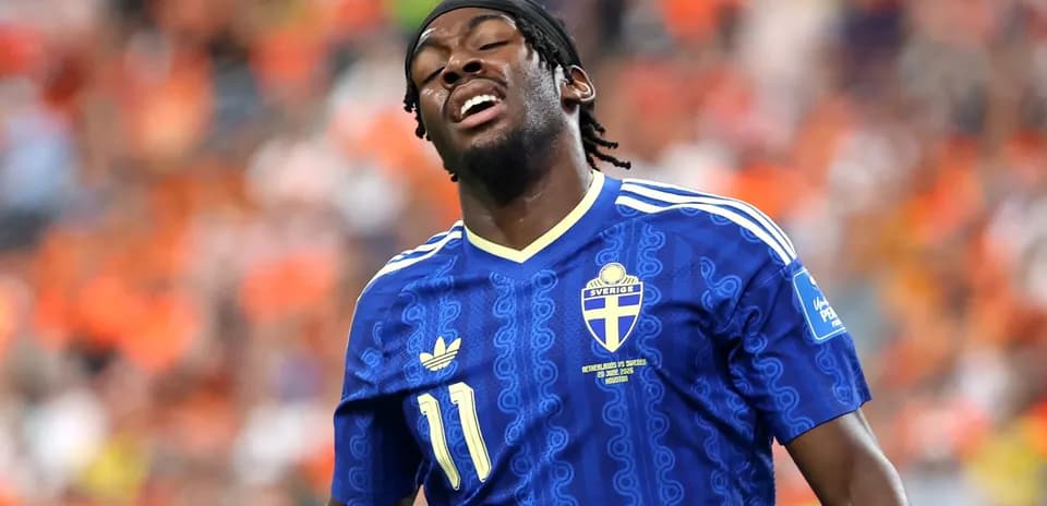 Player wearing Sweden jersey during match action