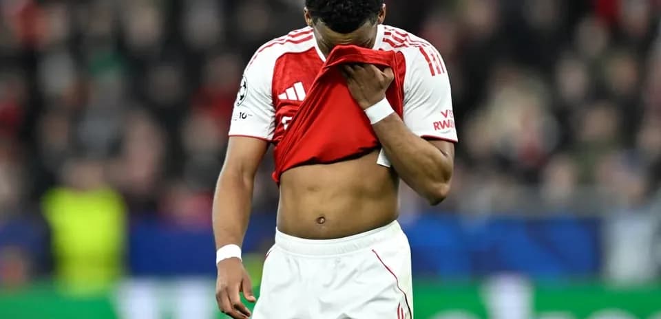 Player holding shirt to face after match