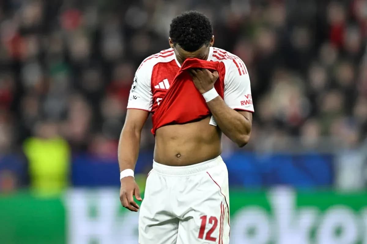Player holding shirt to face after match