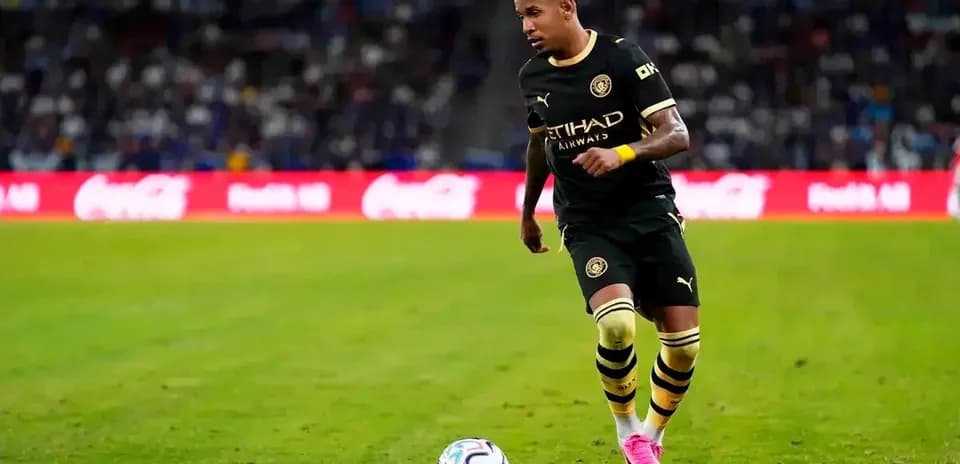 Player dribbling the ball on the pitch