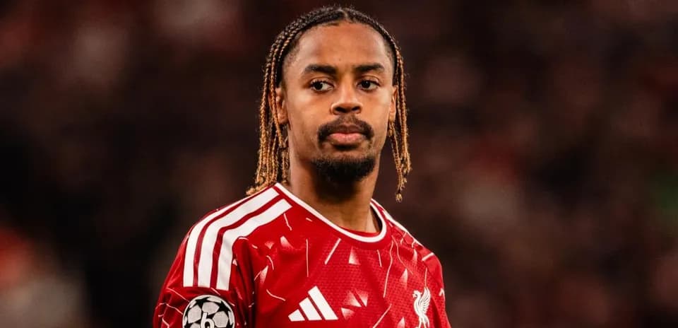 Liverpool player wearing red kit during match