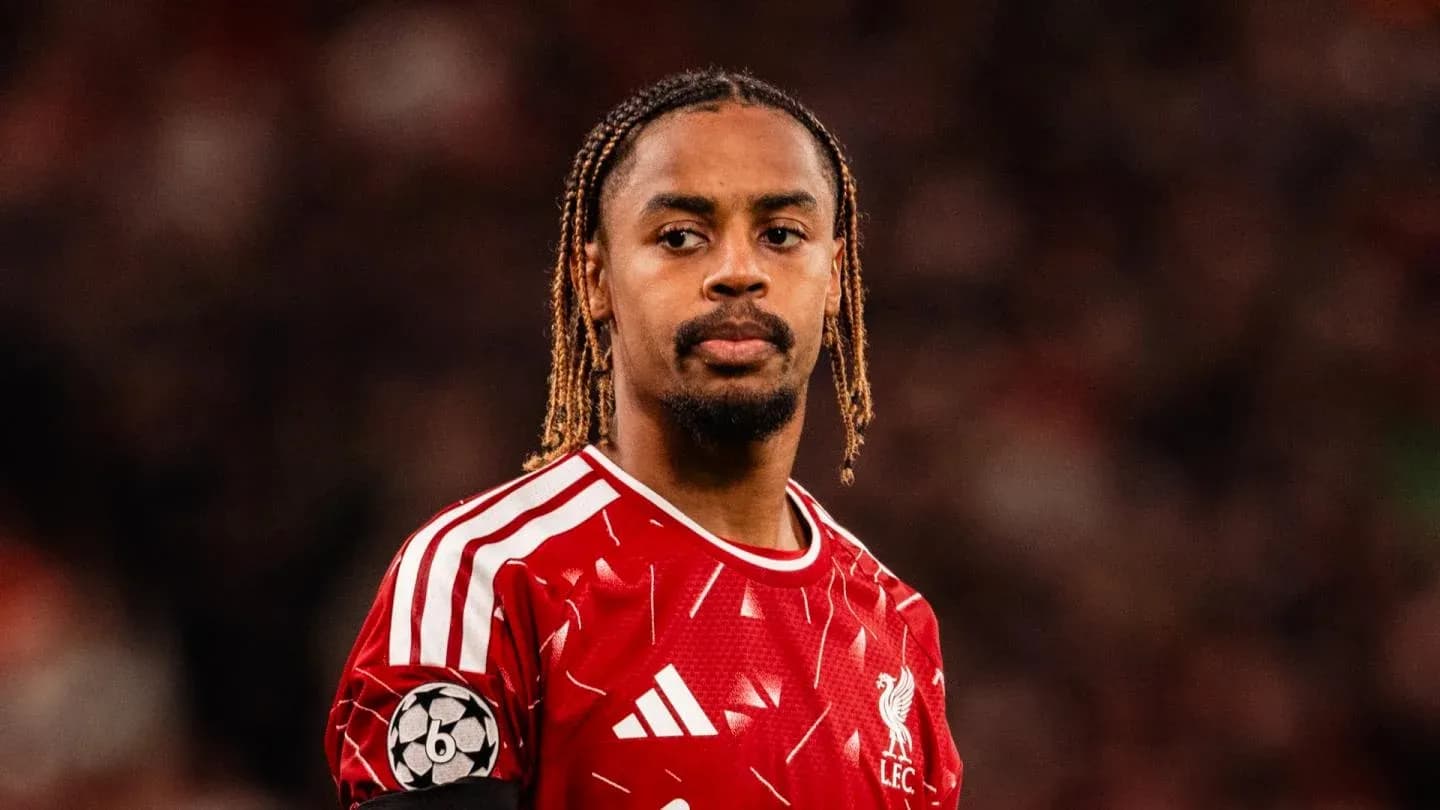 Liverpool player wearing red kit during match