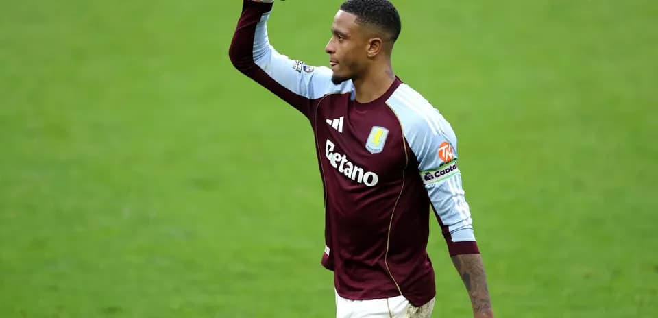 Aston Villa player celebrating on the pitch
