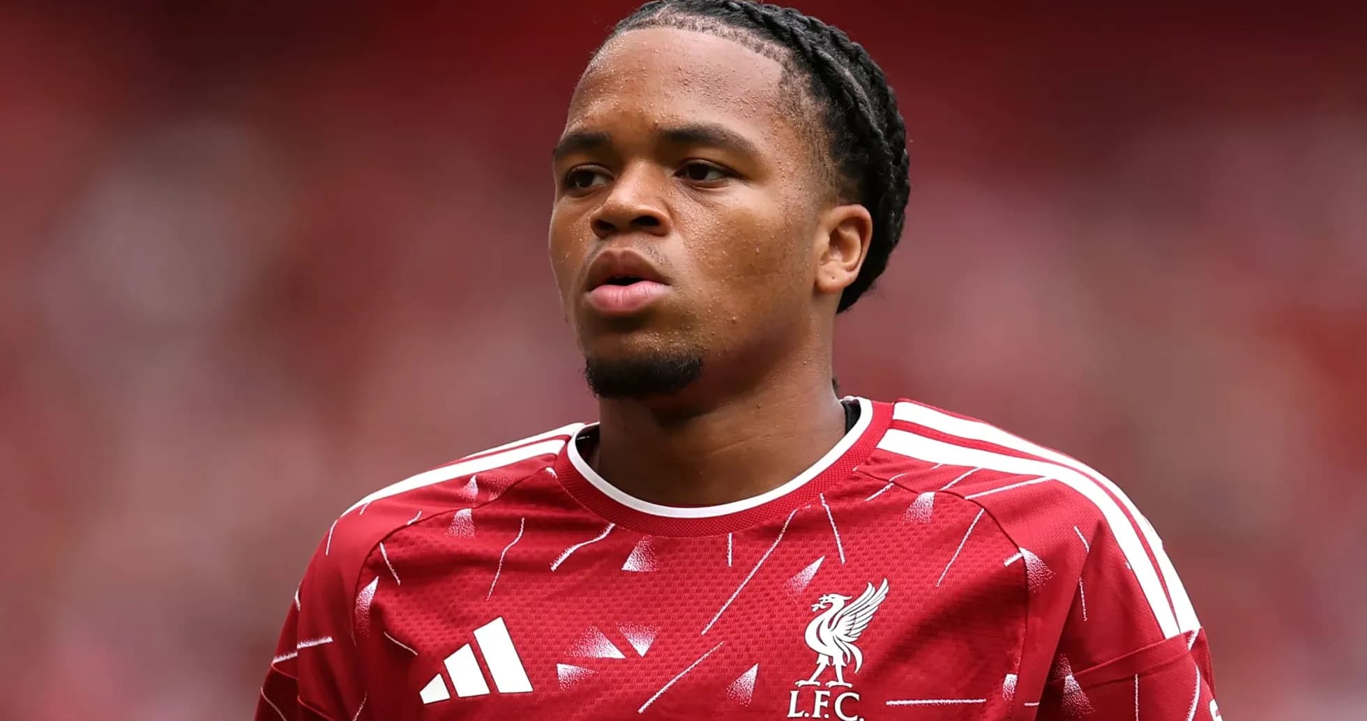 Player in Liverpool kit during match warm-up