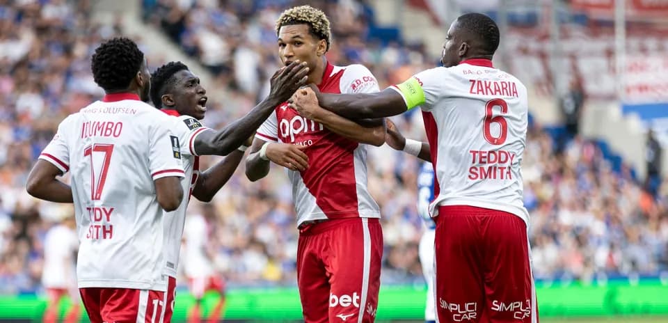 Players celebrating a goal during the match